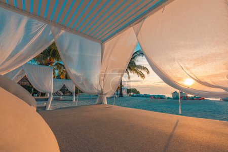 Photo for Relax on a luxury VIP beach with nice pavilion in a sunshine blue sky day. Luxurious vacation and beach holiday in tropical resort, hotel. - Royalty Free Image