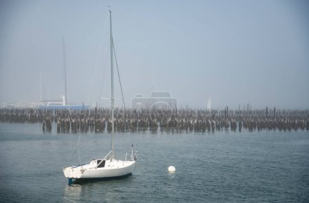 Photo for Portland Harbor in Maine, Sailboats during a foggy day. USA - Royalty Free Image