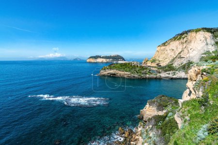 Photo for View on the Trentaremi bay of Posillipo, a district of Naples, Italy. There is a small empty beach in a cove. The coast overlooks the Mediterranean Sea. - Royalty Free Image