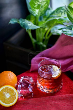 Photo for Orange alcoholic cocktail in a beautiful  glass close-up - Royalty Free Image