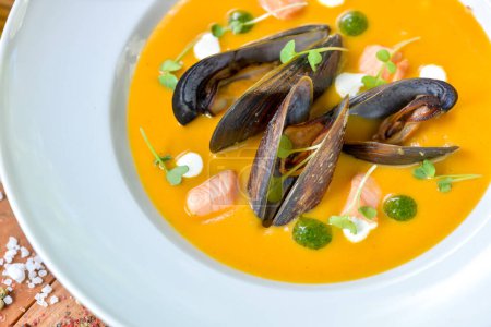 Photo for Soup with mussels and squid in a plate - Royalty Free Image