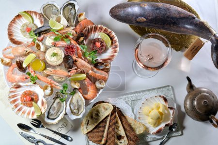 Photo for Seafood platter. fresh mussels, shrimps and bread. top view - Royalty Free Image