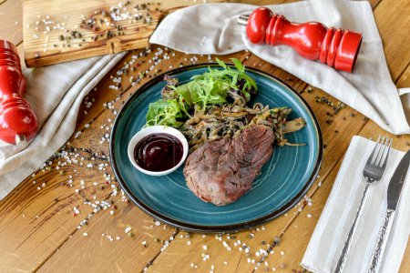 Photo for Grilled beef steak and spices on a wooden board - Royalty Free Image