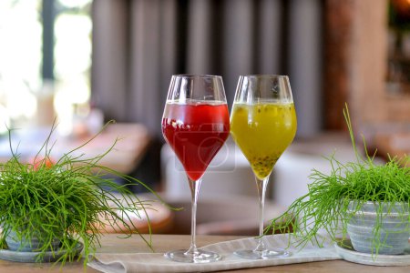 Photo for Two different natural lemonades with passion fruit and raspberry - Royalty Free Image