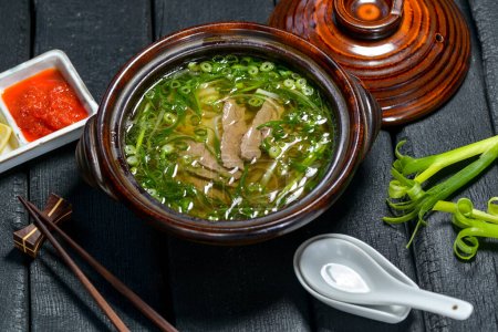 Photo for Close up view of delicious soup with meat and onion - Royalty Free Image