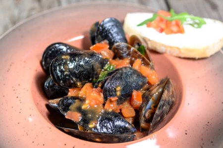 Photo for Mussels cooking according to oriental recipe on background, close up - Royalty Free Image