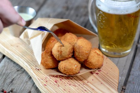 Photo for Deep fried Cheese balls with sauce and beer - Royalty Free Image