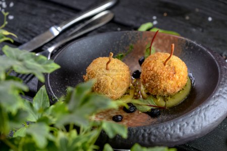 Photo for Delicious Deep fried cheese balls with herbs and spices - Royalty Free Image
