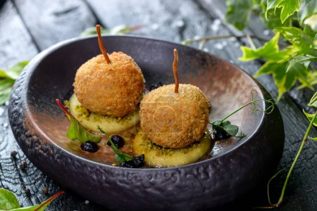 Photo for Delicious Deep fried cheese balls with herbs and spices - Royalty Free Image