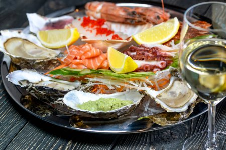Photo for Fresh seafood with white wine on wooden background - Royalty Free Image