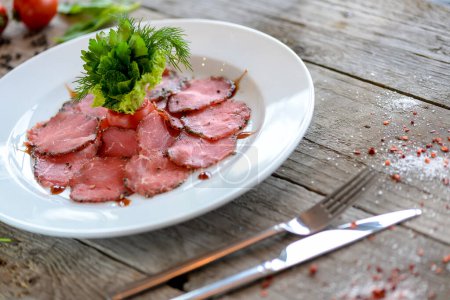 Photo for Raw meat slices with herbs and spices on wooden table. top view - Royalty Free Image
