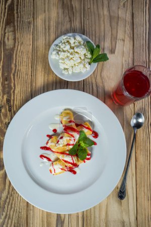 Photo for Sweet   pancakes with strawberry sauce and cottage cheese - Royalty Free Image