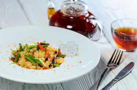 Photo for Plate of fried rice with  vegetables , green beans and tea - Royalty Free Image