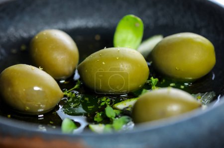 Photo for Tasty olives with limo in a beautiful plate - Royalty Free Image