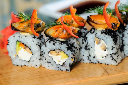 Photo for Japanese rolls with cheese, vegetables,mussels and black caviar - Royalty Free Image