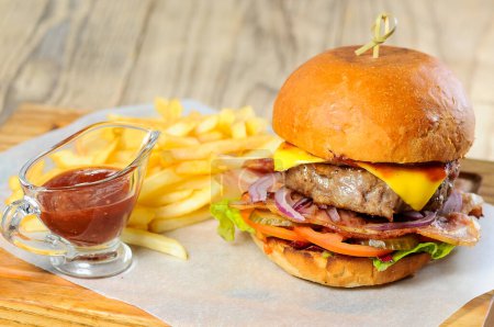 Photo for Tasty beef burger and french fries on table, close view - Royalty Free Image