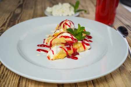 Photo for Pancakes with strawberry sauce and cottage cheese - Royalty Free Image