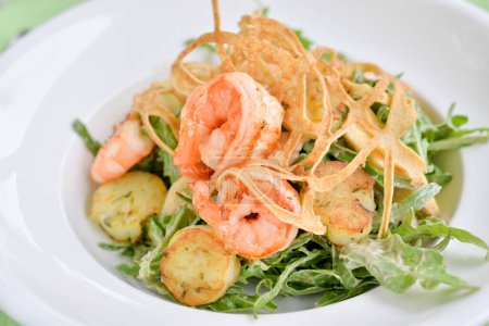 Photo for Tasty shrimps salad  and herbs on background, close up - Royalty Free Image