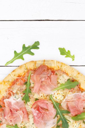 Photo for Ham pizza prosciutto from above copyspace copy space portrait format close up on wooden board wood - Royalty Free Image