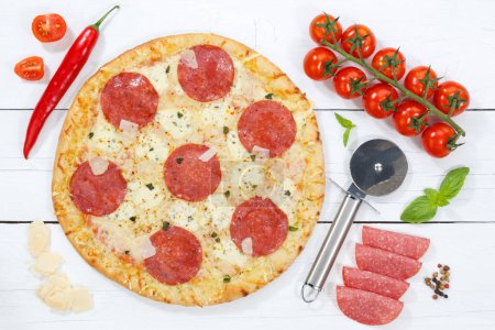 Photo for Salami pizza from above ingredients on wooden board wood - Royalty Free Image