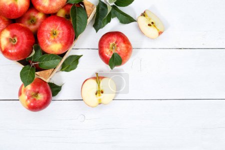 Photo for Apples apple fruits fruit with leaves from above copyspace copy space wooden board wood - Royalty Free Image