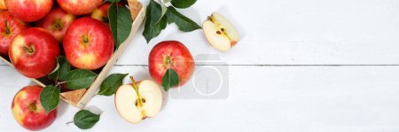 Photo for Apples apple fruits fruit with leaves from above banner copyspace copy space wooden board wood - Royalty Free Image