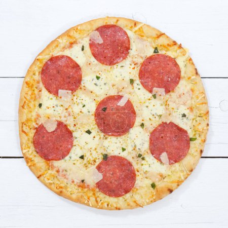Téléchargez les photos : Pizza salami from above square on a wooden board wood - en image libre de droit