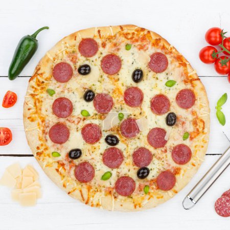 Foto de Pepperoni salami pizza from above square ingredients on wooden board wood - Imagen libre de derechos