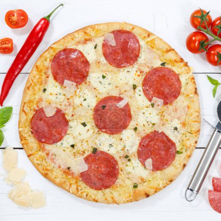 Photo for Salami pizza from above square ingredients on wooden board wood - Royalty Free Image