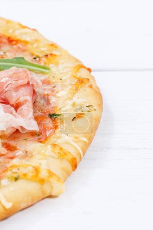 Téléchargez les photos : Ham pizza prosciutto copyspace portrait format copy space on wooden board wood - en image libre de droit