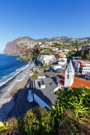 Photo for View on the town of Camara de Lobos with church travel portrait format on Madeira island in Portugal - Royalty Free Image