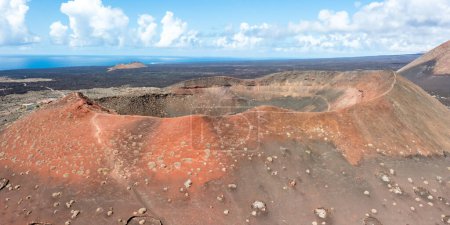 Photo for Volcanic crater volcanos in Timanfaya National Park on Lanzarote island travel aerial view panorama on Canary Islands in Spain - Royalty Free Image