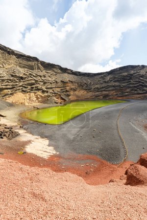 Photo for Green lake Charco de Los Clicos Verde near El Golfo portrait format travel on Lanzarote island on Canary Islands in Spain - Royalty Free Image