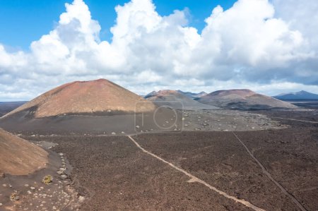 Photo for Volcanos in Timanfaya National Park on Lanzarote island travel aerial view on Canary Islands in Spain - Royalty Free Image