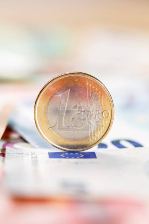 Photo for One Euro coin money saving pay paying finances portrait format with copyspace copy space rich - Royalty Free Image
