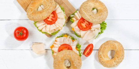 Photo for Bagel sandwich with chicken breast ham for breakfast from above panorama - Royalty Free Image