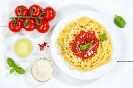 Photo for Spaghetti meal from Italy eat pasta lunch with tomato sauce from above - Royalty Free Image