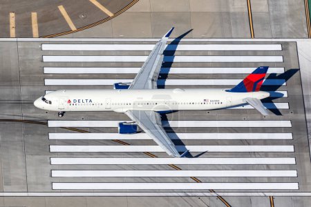 Photo for Los Angeles, United States - November 4, 2022 Delta Air Lines Airbus A321 airplane at Los Angeles airport (LAX) in the United States aerial view. - Royalty Free Image