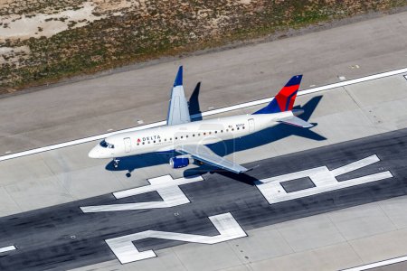 Photo for Los Angeles, United States  November 4, 2022 Delta Connection Embraer 175 airplane aerial photo at Los Angeles airport (LAX) in the United States. - Royalty Free Image