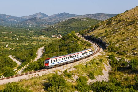 Photo for Prgomet, Croatia - June 1, 2023: Commuter train with tilting system of Croatian Railways Hrvatske Zeljeznice near Prgomet, Croatia. - Royalty Free Image
