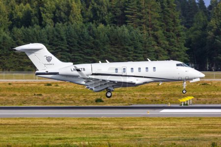 Photo for Oslo, Norway - August 15, 2022: Strawberry Sundt Air Bombardier Challenger 350 airplane at Oslo Airport (OSL) in Norway. - Royalty Free Image