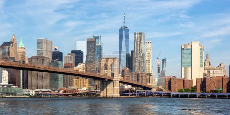 Photo for New York City skyline of Manhattan with Brooklyn Bridge and World Trade Center skyscraper panorama traveling in the United States - Royalty Free Image