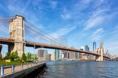 Photo for Brooklyn Bridge in New York City skyline of Manhattan with World Trade Center skyscraper traveling in the United States - Royalty Free Image