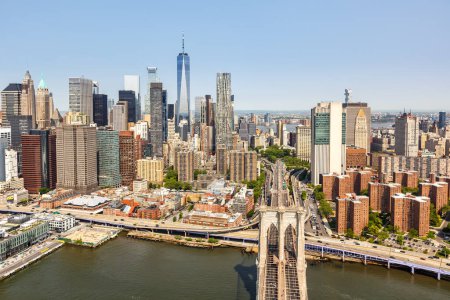Photo for New York City skyline aerial view of Manhattan with World Trade Center skyscraper and Brooklyn Bridge traveling in the United States - Royalty Free Image