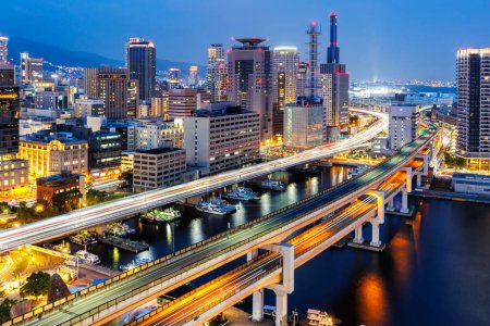 Photo for Kobe skyline from above with port and elevated road traffic at twilight in Japan - Royalty Free Image
