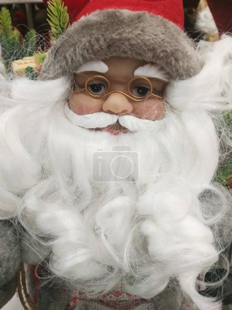 Photo for Santa Claus looking into the camera with traditional background and hands crossed in front of him - Royalty Free Image