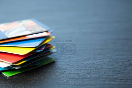 Photo for Stack of bank cards on a black background - Royalty Free Image
