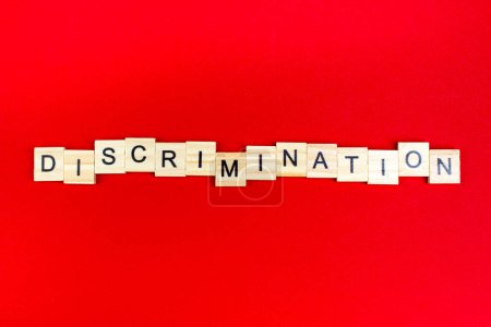 Photo for Discrimination- word composed fromwooden blocks letters on red background, copy space for ad text - Royalty Free Image