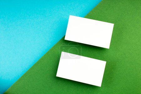 Photo for Business card blank over colorful abstract background. Corporate stationery branding mock-up. Copy space for text. Top view - Royalty Free Image
