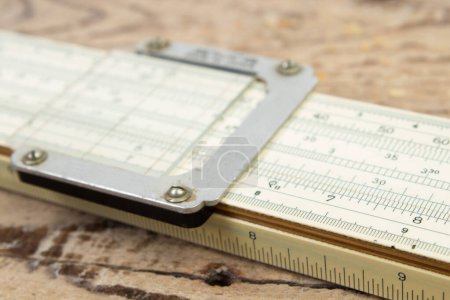 Photo for Logarithmic ruler, pencil on a wooden table. Stationery for engineers and students - Royalty Free Image